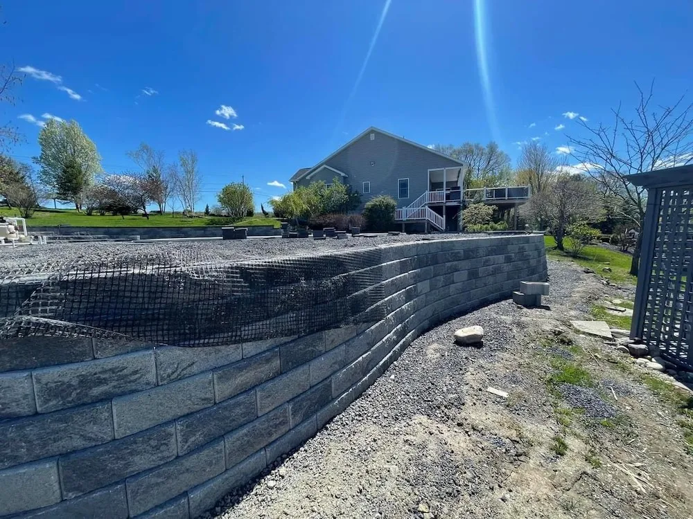 Retaining wall installation with pool install Slingerlands NY — Capital Land Companies