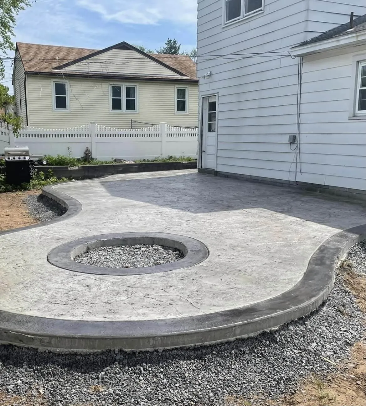Stamped concrete around fire pit Albany Guilderland NY — Capital Land Companies